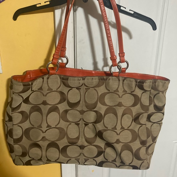 Beautiful orange and brown Coach purse